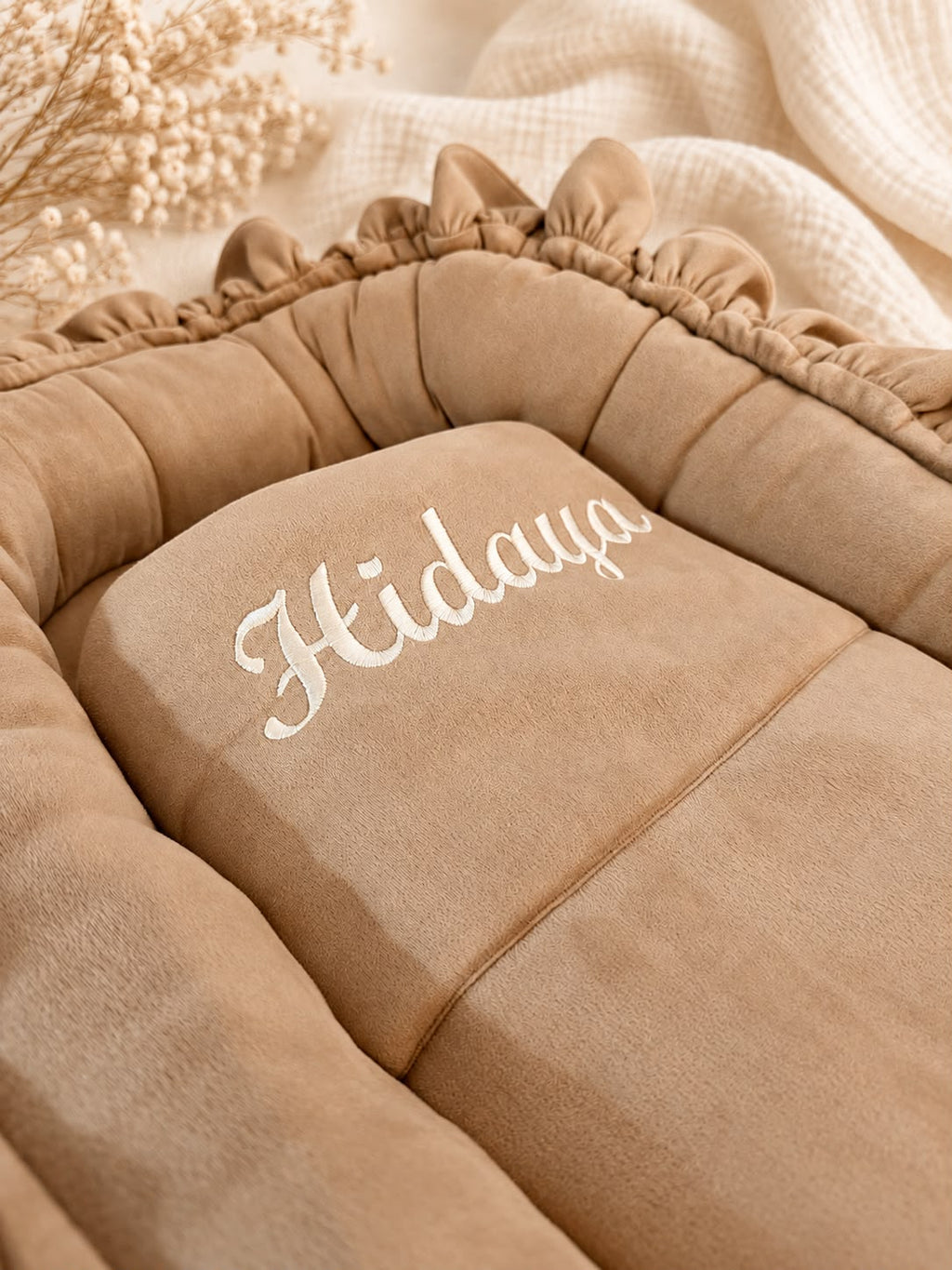 Personalized suede baby nest with blanket.