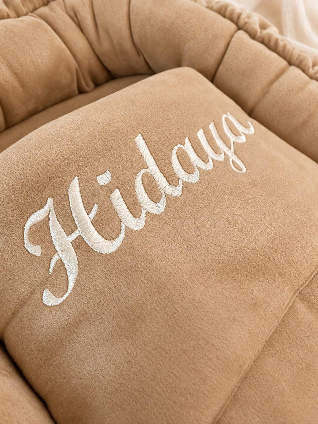 Personalized suede baby nest with blanket.